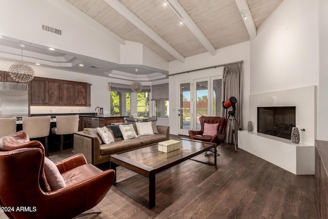 living room featuring dark hardwood / wood-style floors, wood ceiling, high vaulted ceiling, and a chandelier