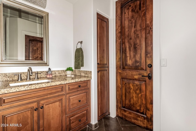 bathroom with tile patterned flooring and vanity