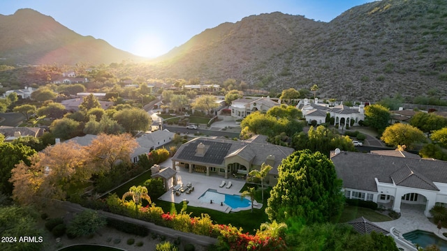 birds eye view of property with a mountain view