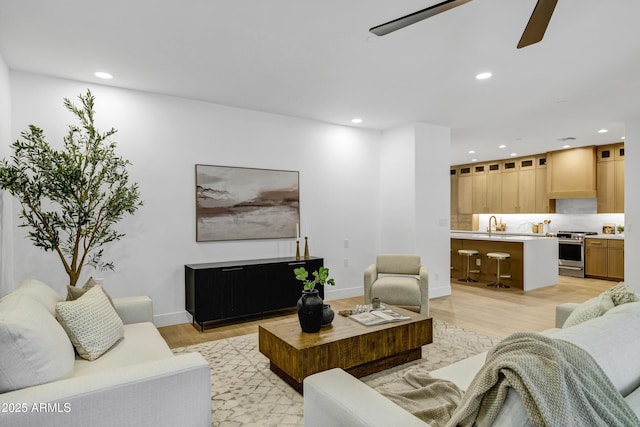 2774 E Valencia St, Gilbert, AZ 85296 - living room with light wood-style floors, recessed lighting, ceiling fan, and baseboards