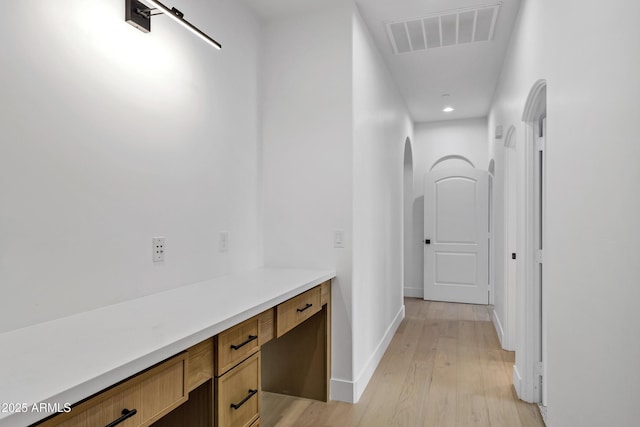 2774 E Valencia St, Gilbert, AZ 85296 - hall with arched walkways, light wood-style floors, recessed lighting, and baseboards