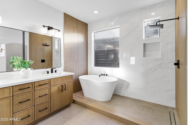 2774 E Valencia St, Gilbert, AZ 85296 - bathroom featuring double vanity, walk in shower, tile walls, a soaking tub, and tile patterned floors