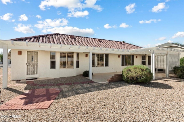 back of house featuring a patio area and a pergola