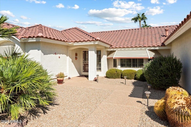 mediterranean / spanish-style home featuring a patio area