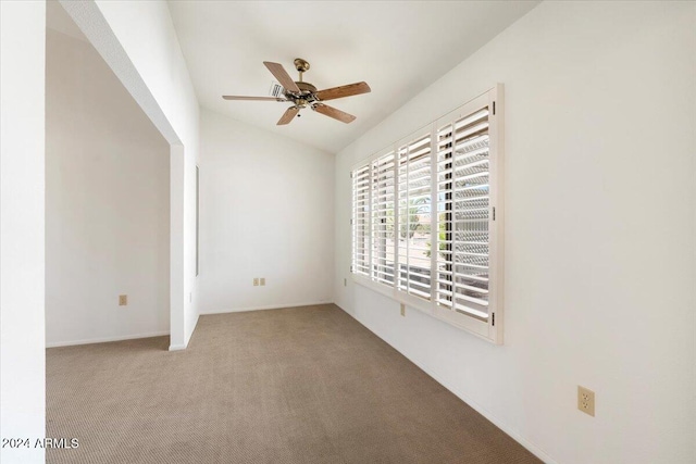 empty room featuring light carpet and ceiling fan