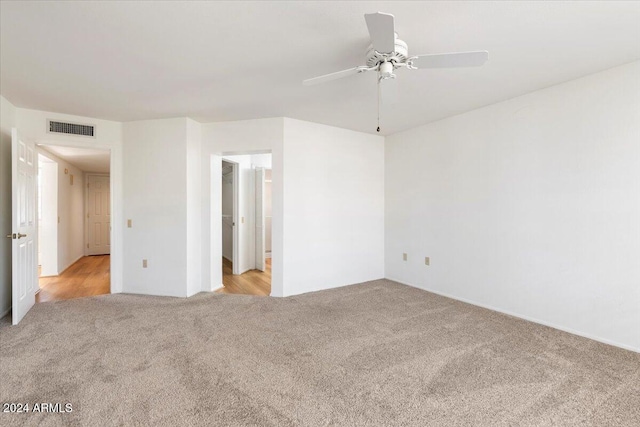 unfurnished bedroom with light carpet and ceiling fan