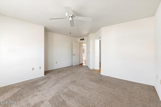 unfurnished room with carpet flooring and ceiling fan