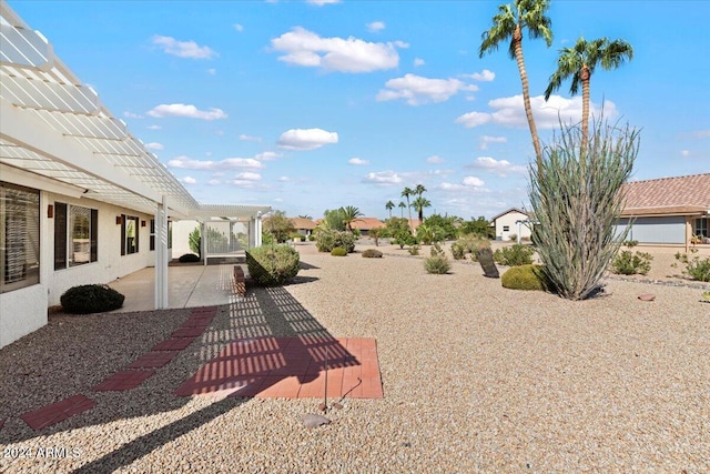 view of yard featuring a patio area and a pergola