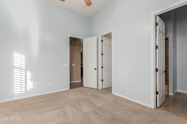 unfurnished bedroom with light colored carpet and ceiling fan