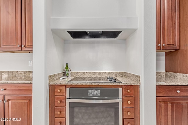 bar with black electric cooktop, ventilation hood, and oven