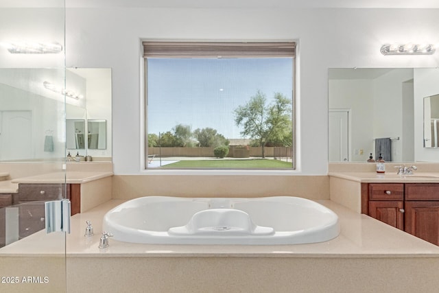 full bath featuring a bath and vanity
