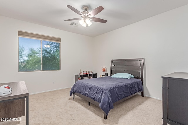 bedroom with baseboards, visible vents, ceiling fan, and light colored carpet