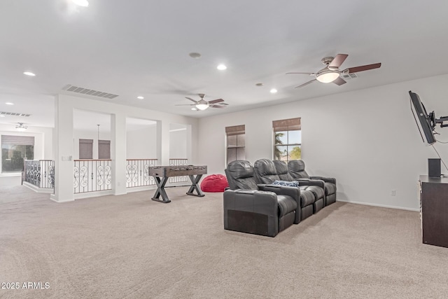 living room featuring recessed lighting, ceiling fan, visible vents, and light carpet