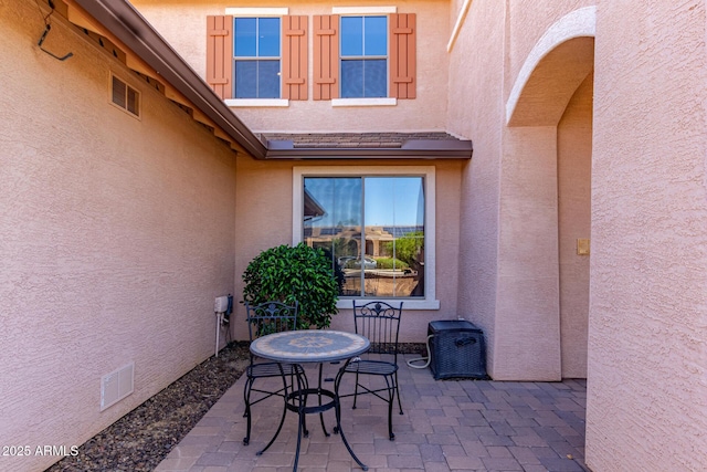 view of patio featuring visible vents