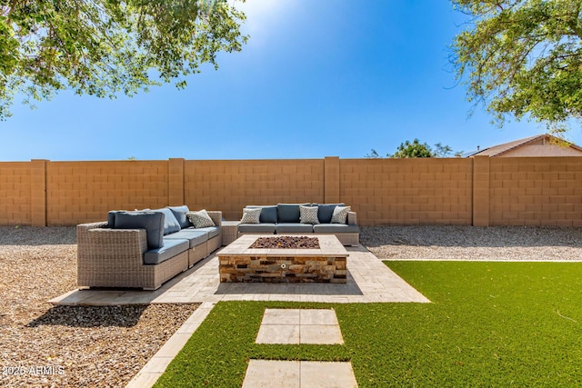 view of yard featuring a patio, a fenced backyard, and an outdoor living space with a fire pit