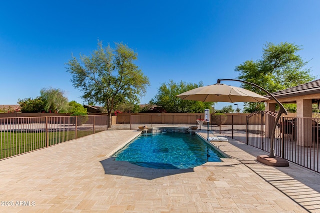 view of pool with a fenced in pool, fence, and a patio