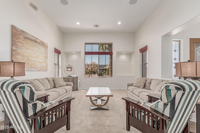 living area with visible vents, carpet flooring, and recessed lighting
