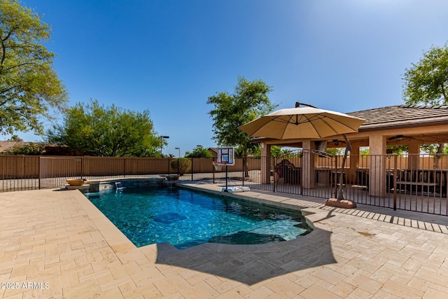 view of pool featuring a fenced backyard, a fenced in pool, and a patio