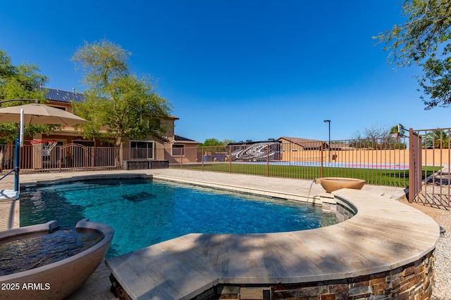 view of swimming pool with a fenced in pool and fence