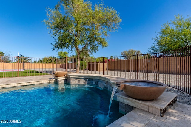 view of pool with a fenced in pool and fence