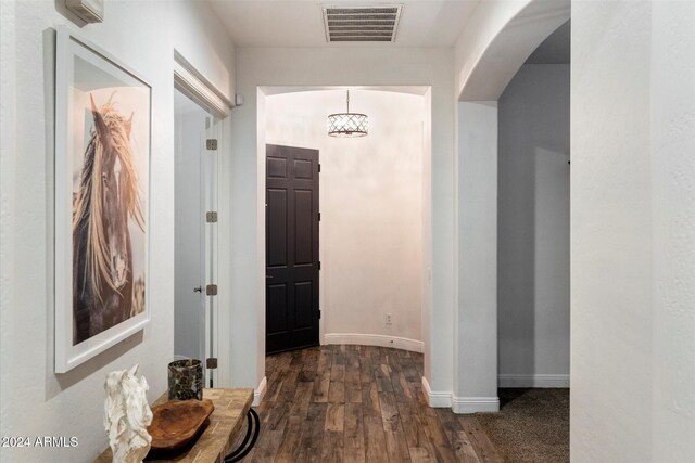 hall with dark wood-type flooring