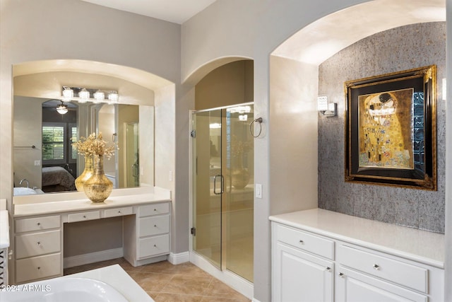 bathroom with ceiling fan, tile patterned flooring, vanity, and an enclosed shower