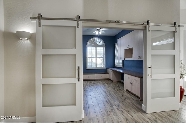 14430 N Agave Dr, Fountain Hills, AZ 85268 - bathroom featuring built in shelves, ceiling fan, hardwood / wood-style floors, and vanity