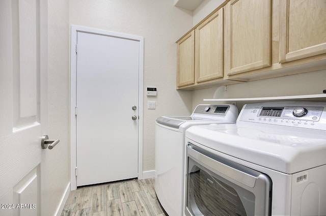 14430 N Agave Dr, Fountain Hills, AZ 85268 - laundry area featuring washer and clothes dryer, cabinets, and light wood-type flooring