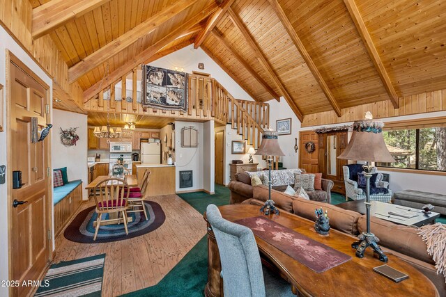 dining room featuring high vaulted ceiling, beamed ceiling, wood ceiling, stairs, and a notable chandelier