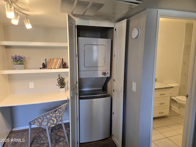 461 W Holmes Ave Unit 360, Mesa, AZ 85210 - washroom with estacked washer and dryer and light tile patterned floors