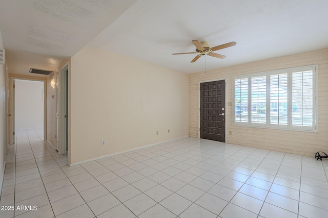 1530 E Loma Ln, Phoenix, AZ 85020 - empty room with a ceiling fan and light tile patterned floors