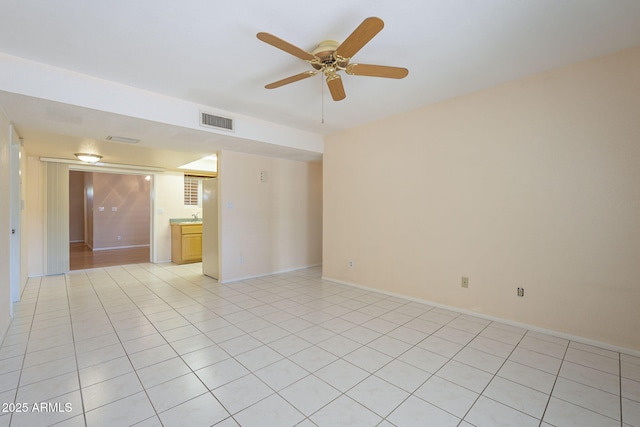 1530 E Loma Ln, Phoenix, AZ 85020 - spare room with light tile patterned floors and ceiling fan
