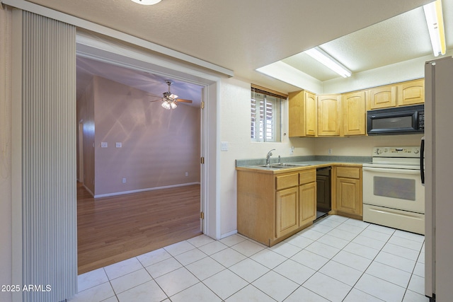 1530 E Loma Ln, Phoenix, AZ 85020 - kitchen with black appliances, light tile patterned floors, ceiling fan, light brown cabinets, and a textured ceiling