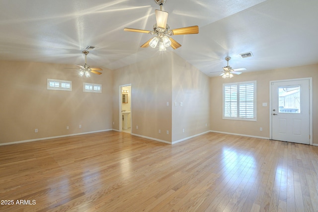 1530 E Loma Ln, Phoenix, AZ 85020 - unfurnished living room with ceiling fan, light wood-style floors, and lofted ceiling