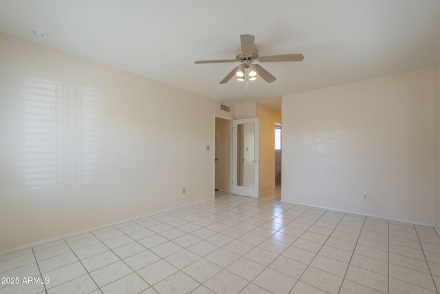 1530 E Loma Ln, Phoenix, AZ 85020 - unfurnished room with ceiling fan and light tile patterned flooring