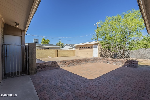 1530 E Loma Ln, Phoenix, AZ 85020 - view of patio with a garage, an outdoor structure, and a gate