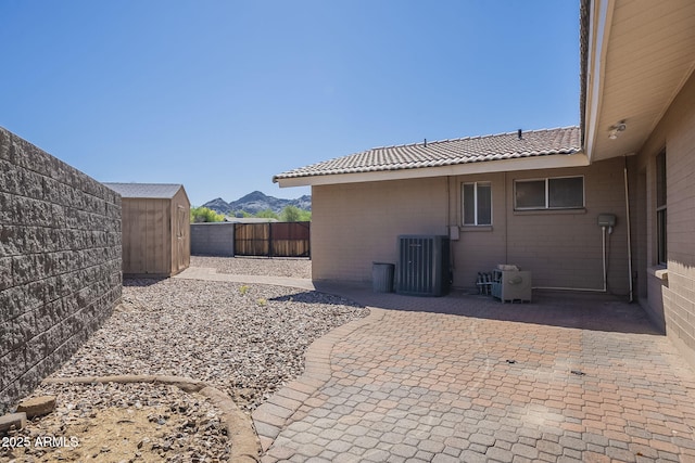 1530 E Loma Ln, Phoenix, AZ 85020 - fenced backyard featuring a patio area and a storage unit