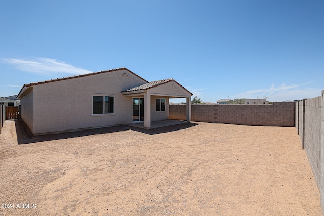 back of house with a patio area