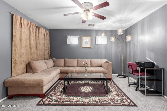 living room featuring ceiling fan and carpet