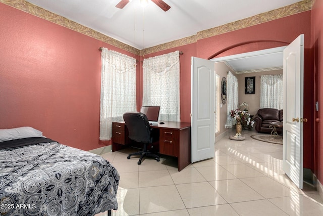 bedroom with ornamental molding, light tile patterned floors, and ceiling fan