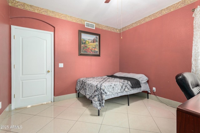 tiled bedroom with ceiling fan