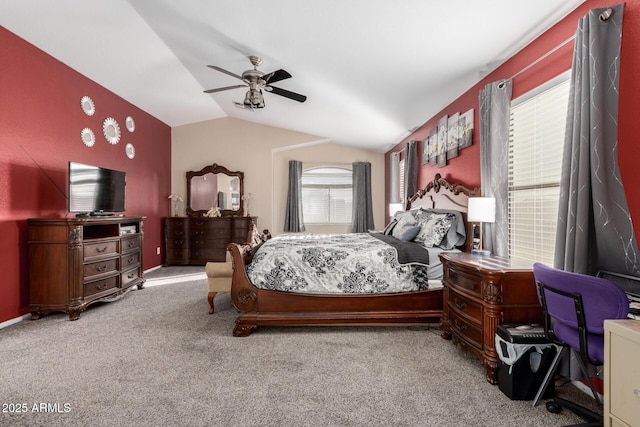 bedroom featuring vaulted ceiling, light colored carpet, and ceiling fan