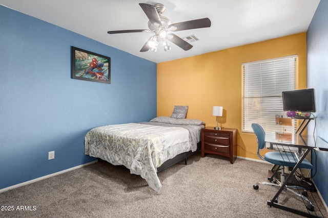 bedroom featuring ceiling fan and carpet