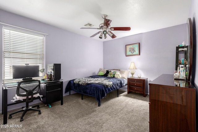 carpeted bedroom with ceiling fan