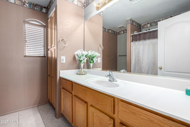 bathroom featuring tile patterned floors and vanity