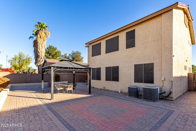 view of patio with a gazebo and central AC