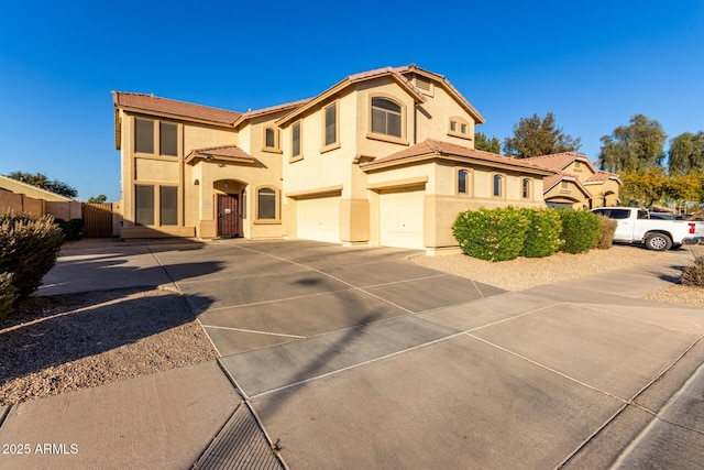 mediterranean / spanish-style home featuring a garage