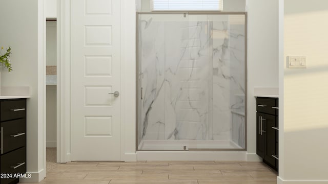 bathroom with vanity and an enclosed shower