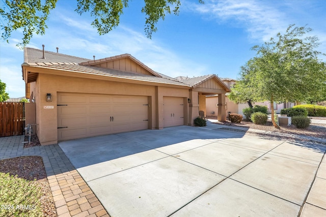 ranch-style home featuring a garage