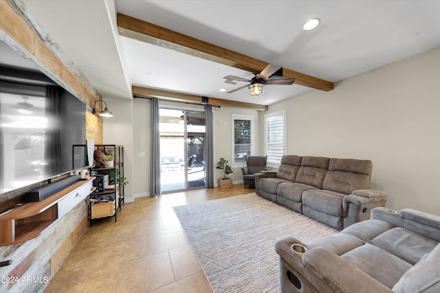 living room featuring ceiling fan, beam ceiling, and light tile patterned floors